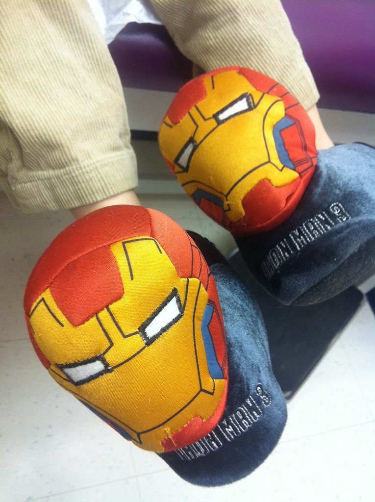 Iron Man slippers on a kid who needs to eat more iron-rich food